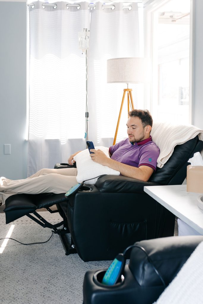 Employee receiving an on-site IV drip during a workplace wellness day in Cincinnati